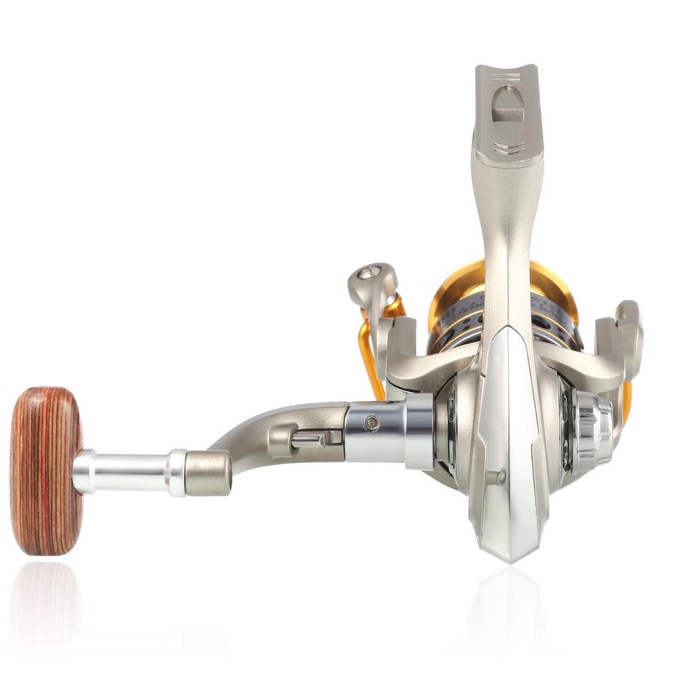 Fishing reel with wooden handle on a white background