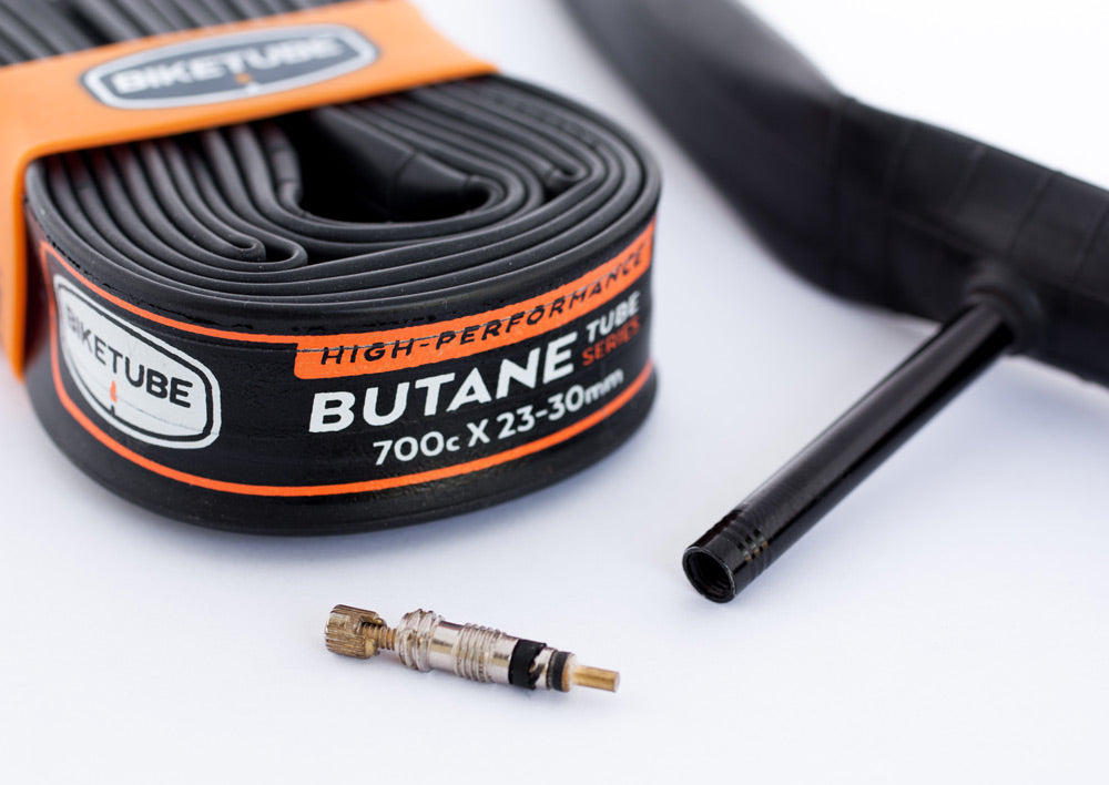 Butane tube with valve and black tube on a white background
