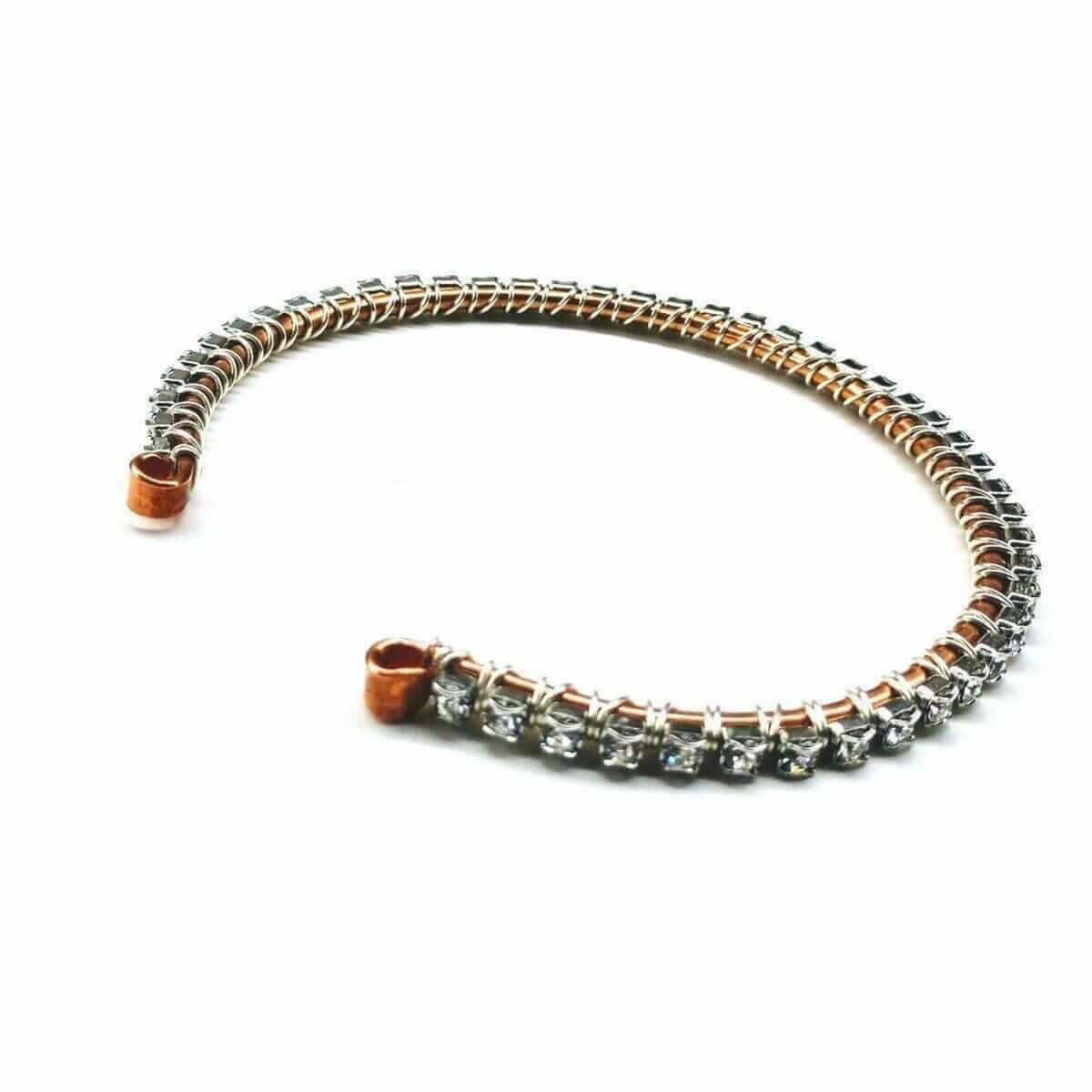 Bracelet with rose gold and silver accents on a white background