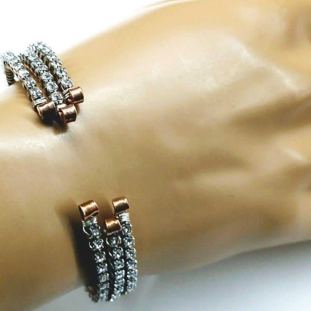 Bracelet with rose gold and silver accents on a mannequin wrist.