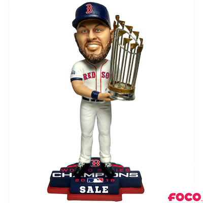 Bobblehead of a red sox baseball player holding a trophy with 'FOCO' branding on a white background