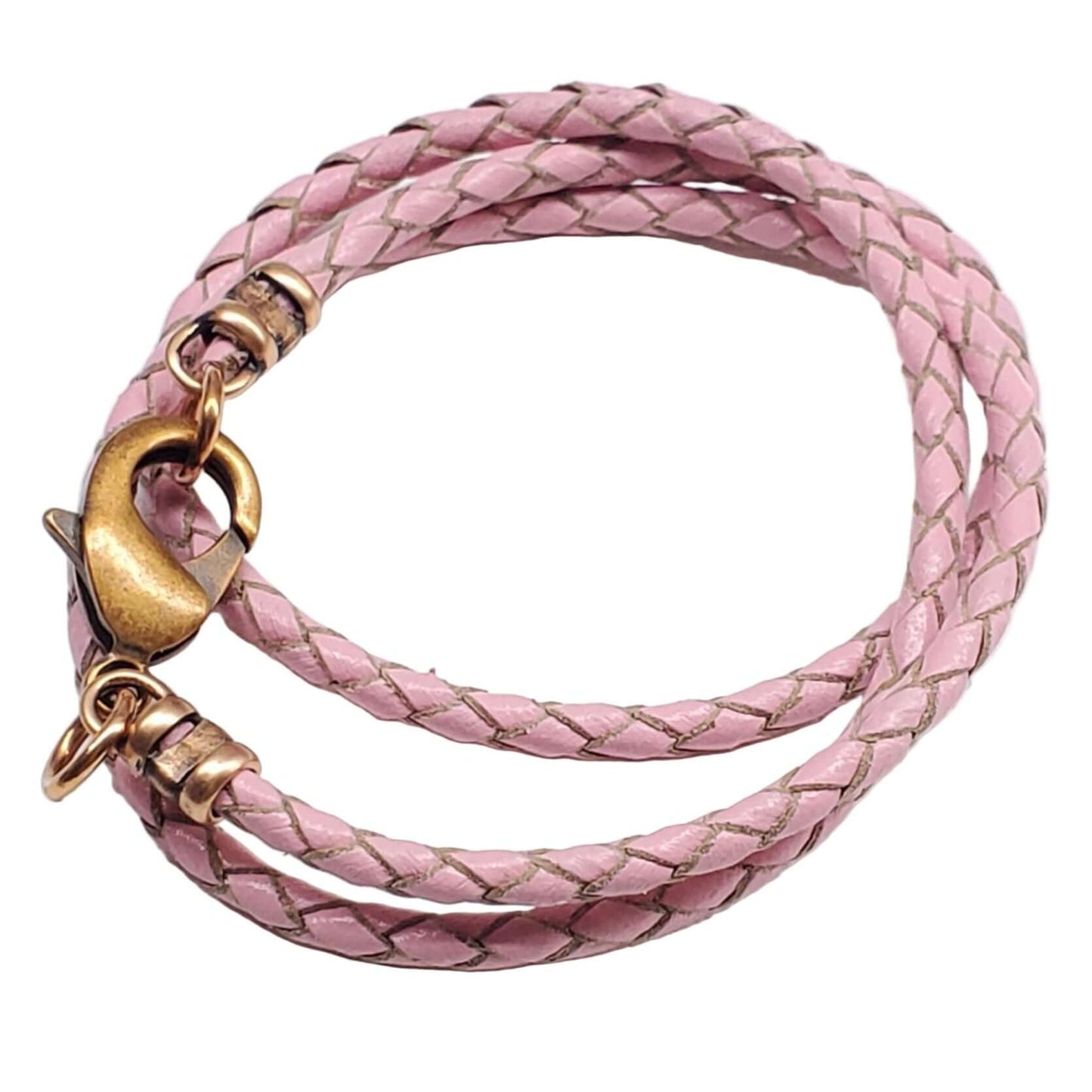 Pink braided leather necklace with gold clasp on a white background