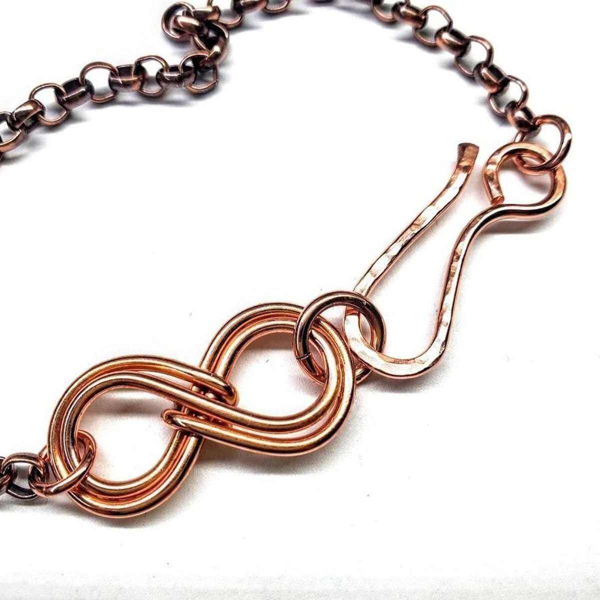 Rose gold chain bracelet on a white background