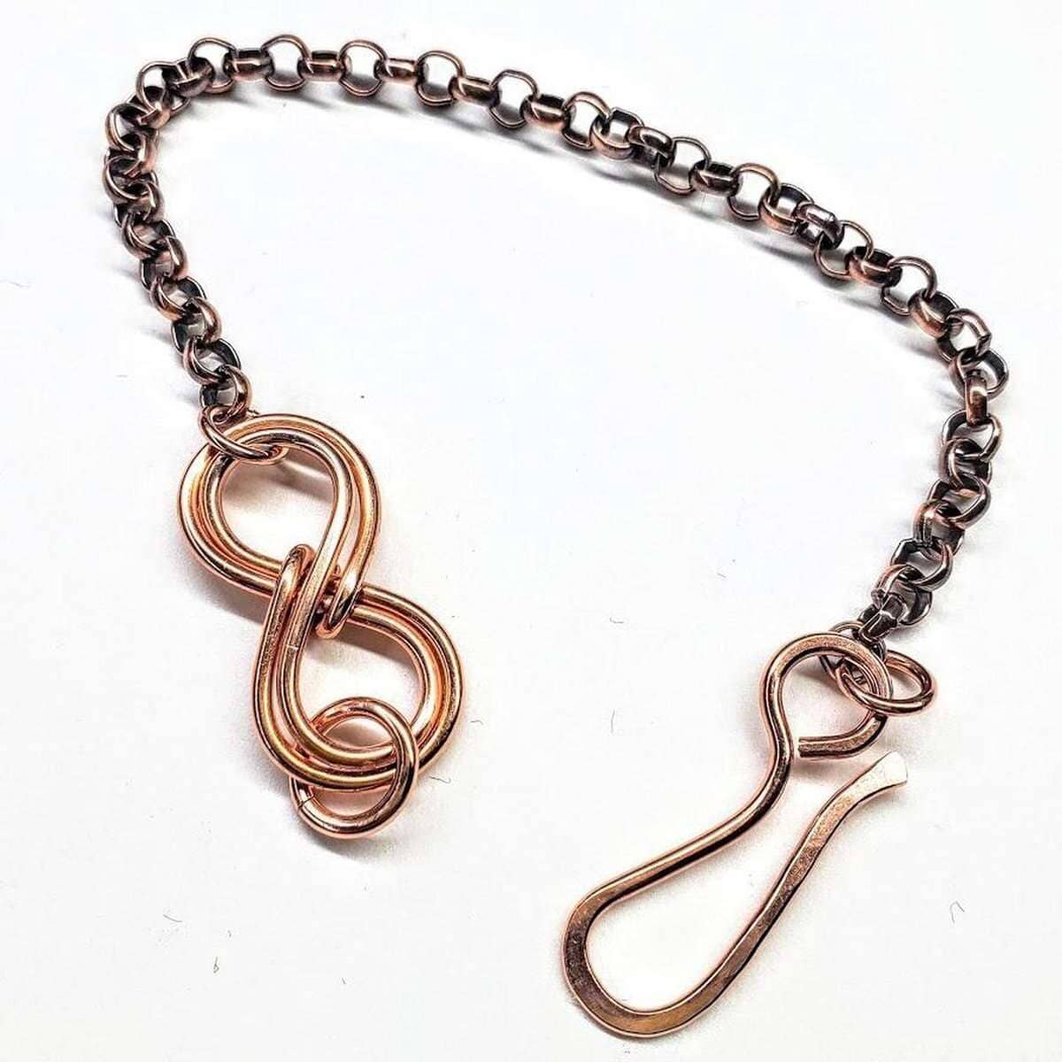Copper chain with unique links on a white background