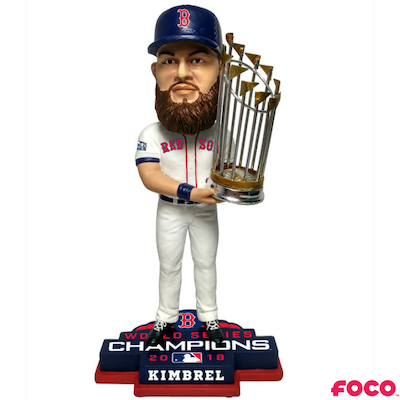 Bobblehead figure of a red sox baseball player holding a World Series trophy with 'FOCO' branding.