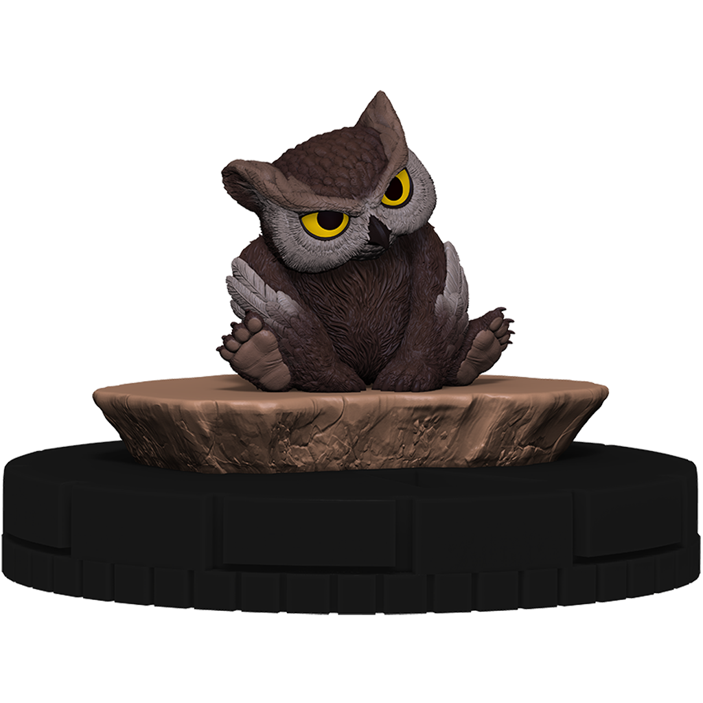 Owl figurine on a rock-like base with a white background