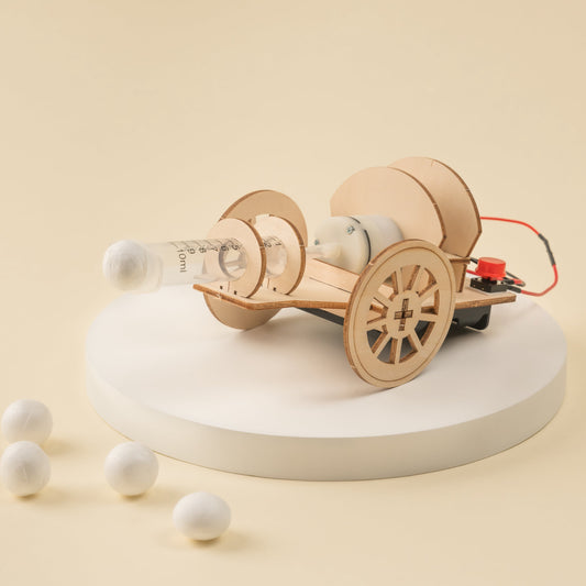 Wooden toy car with wheels on a beige background