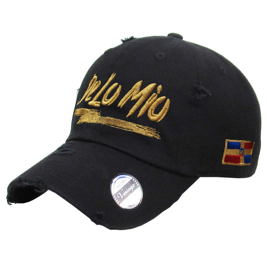 Black cap with gold text and colorful flag patch on a white background