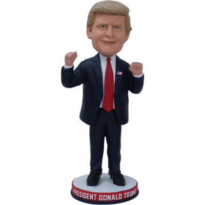 Donald Trump Bobblehead with a red tie on a white background