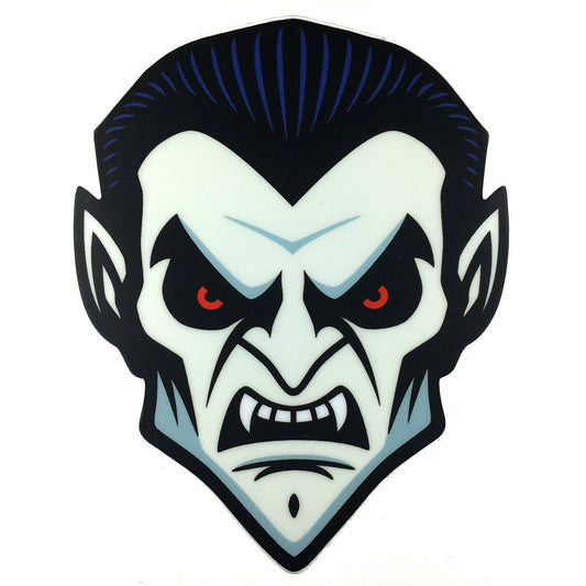 Stylized vampire face sticker with red eyes and fangs on a white background