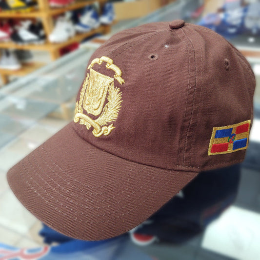 Brown cap with gold Dominican emblem and colorful patch in a store setting