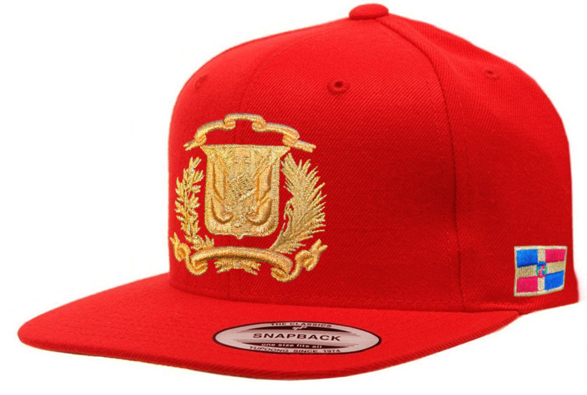 Red snapback cap with gold emblem and colorful flag patch on a white background