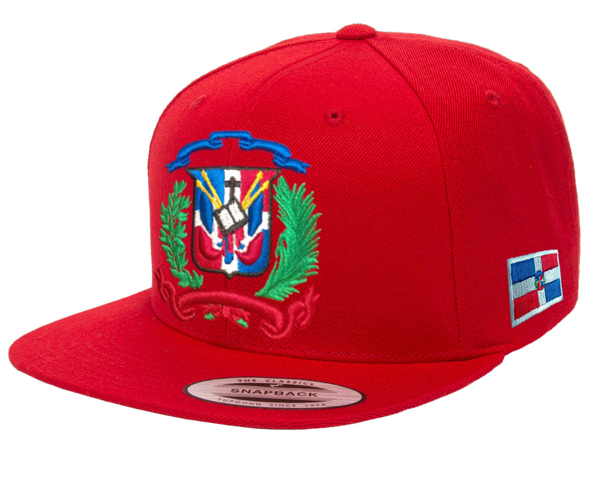 Red snapback cap with a colorful emblem and flag patch on a white background