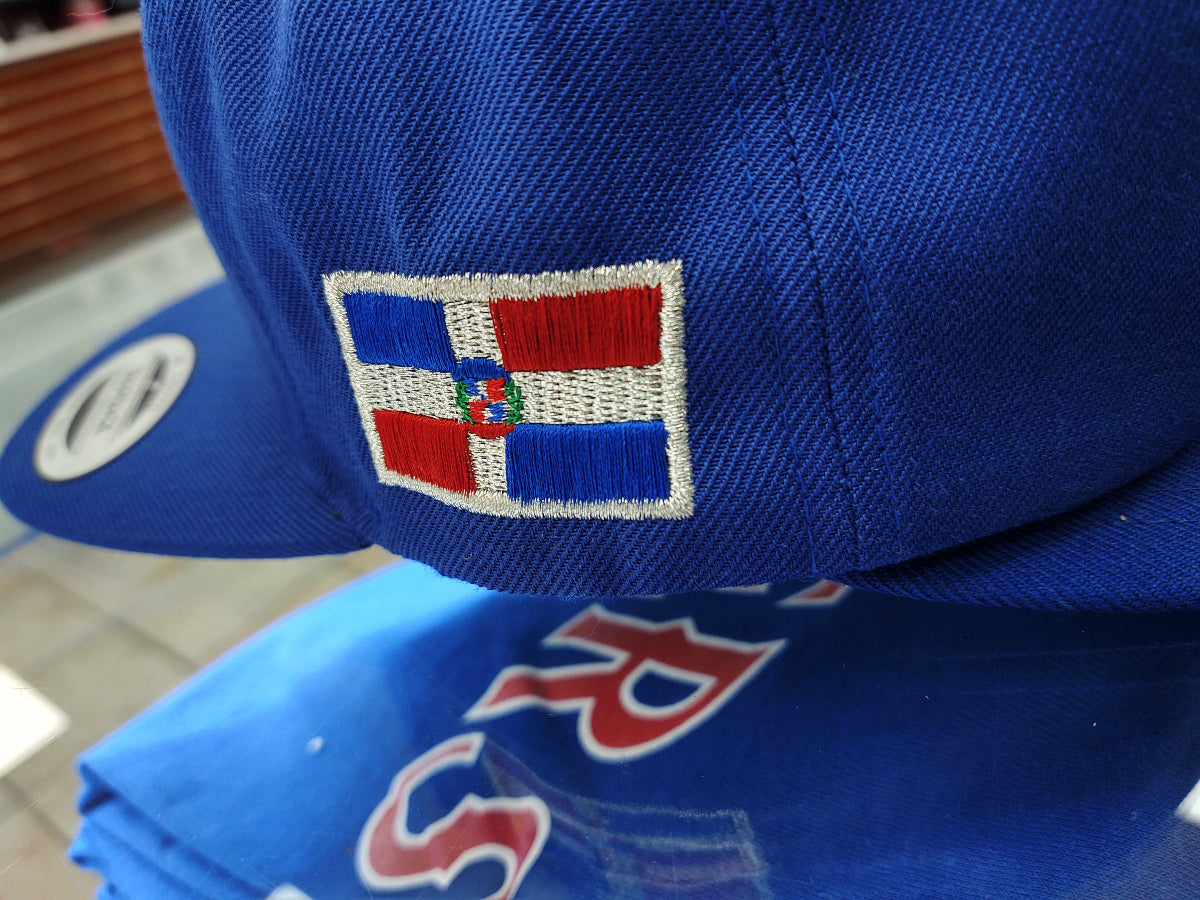 Blue cap with a embroidered logo featuring red, white, and blue colors.