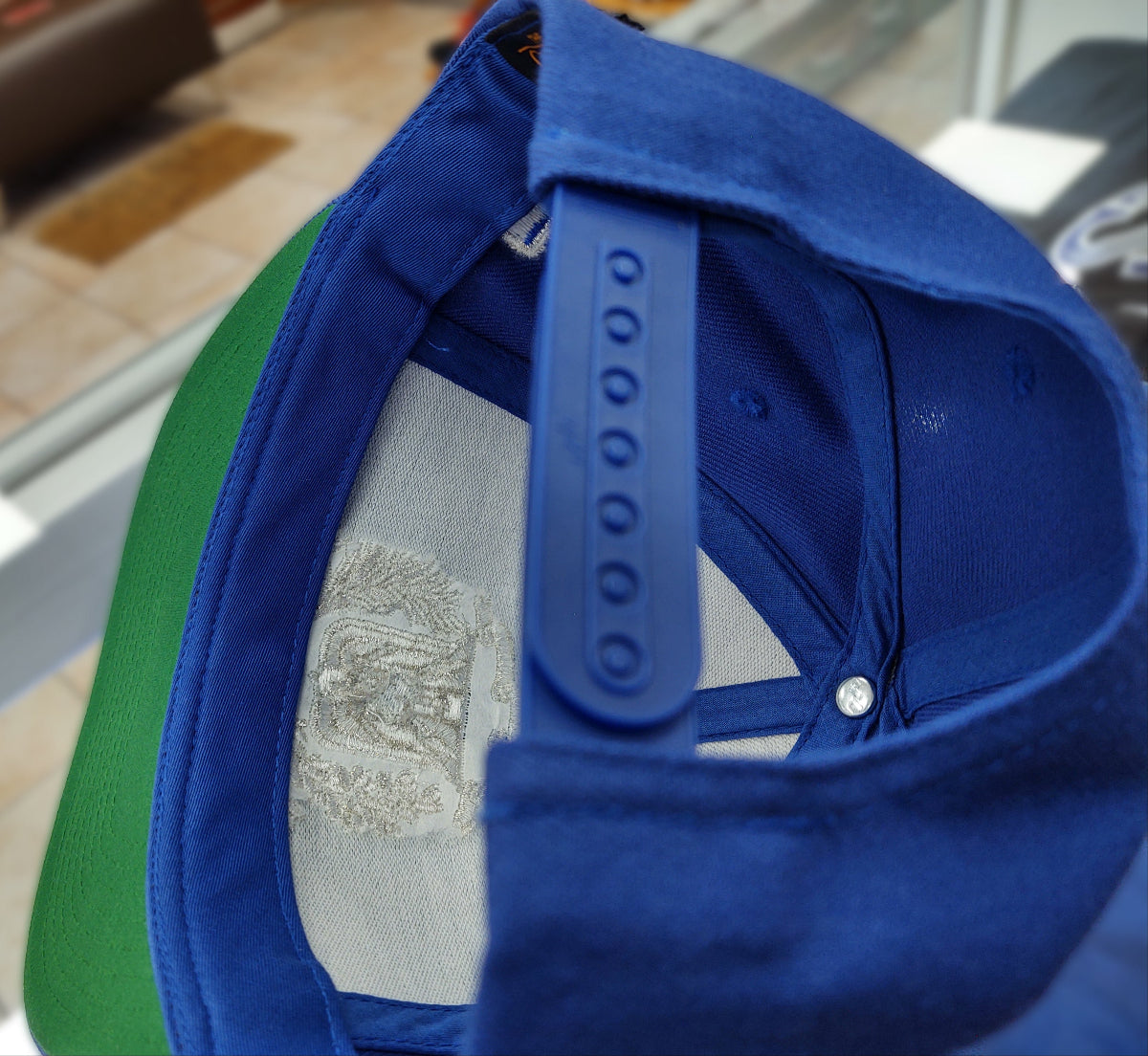 Close-up of a blue cap with a blurred background