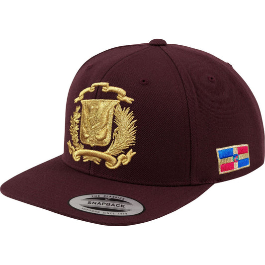 Maroon snapback cap with gold Escudo Republica Dominicana (Dominican Shield) and colorful flag patch on a white background