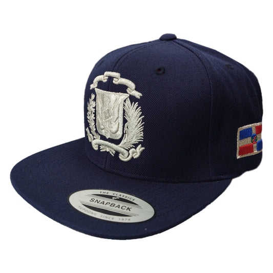 Navy blue snapback cap with embroidered design and colorful flag patch on a white background