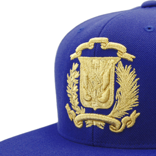 Blue cap with gold embroidered Dominican emblem on a white background