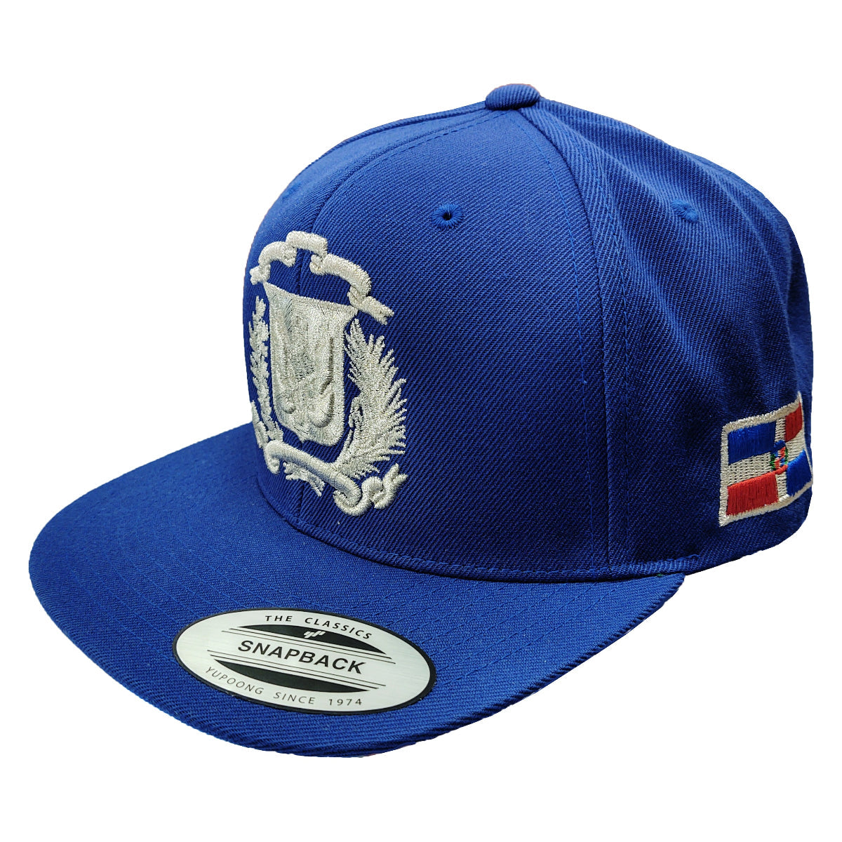 Blue snapback cap with embroidered Dominican Seal design and flag patch on a white background