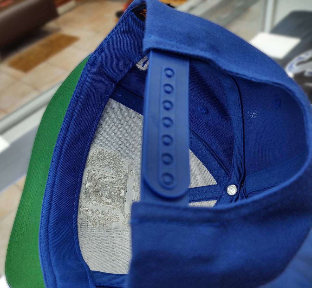 Close-up of a blue cap with a blurred background