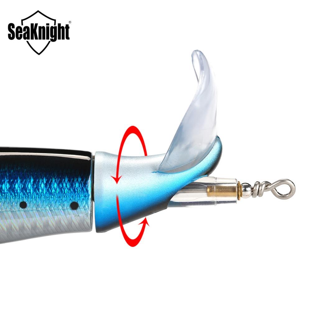 Close-up of a fishing lure with a hook, showing the Seaknight brand and spin of the lures tail