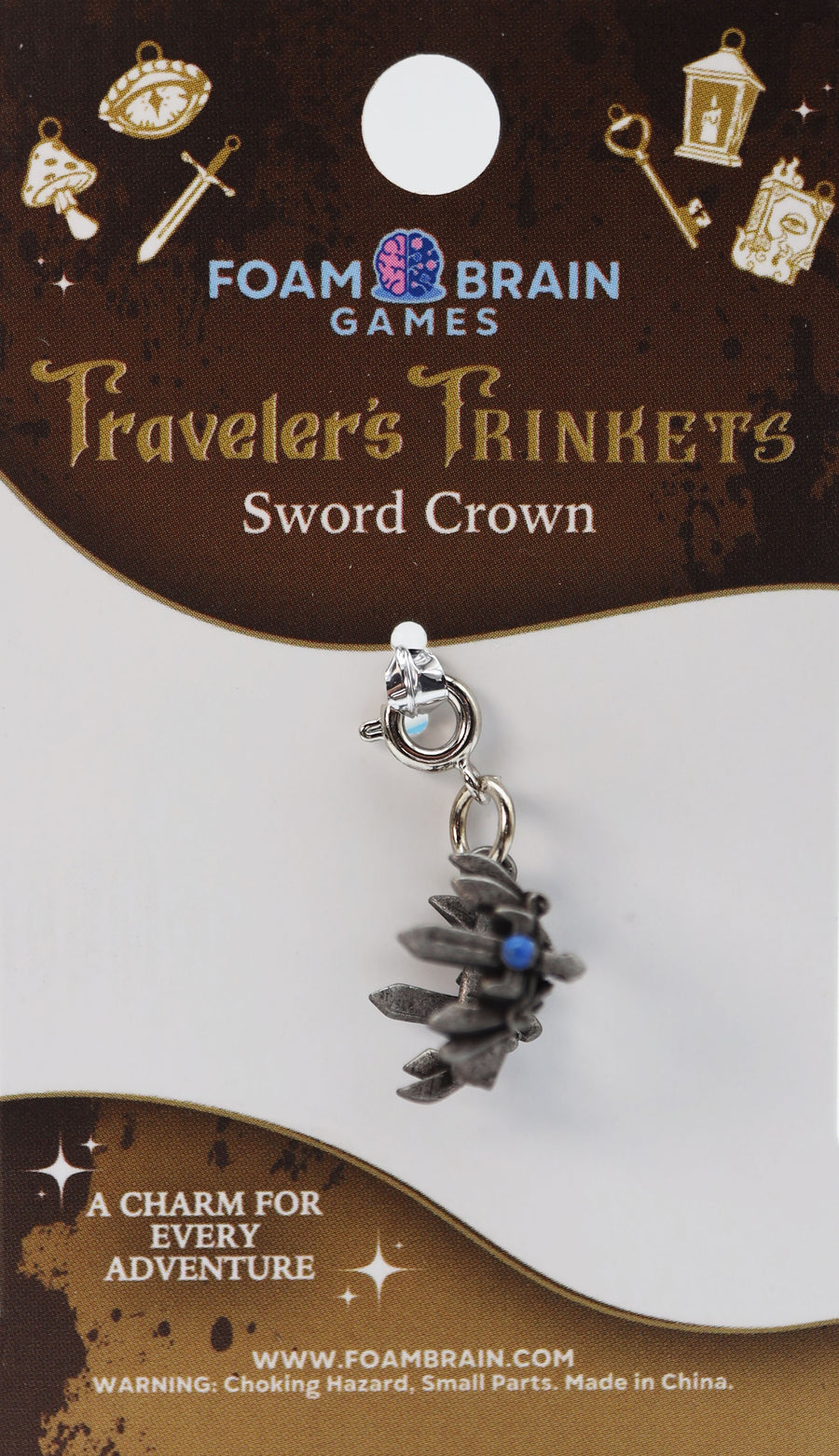 Sword crown charm on Foam Brain Games packaging