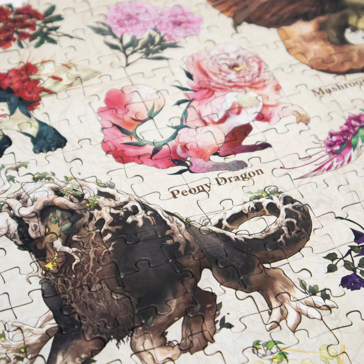 Jigsaw puzzle with a dragon design and floral elements on a white background
