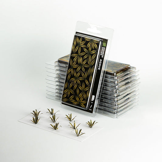 Stack of small transparent containers with green plant-like stickers on a white background