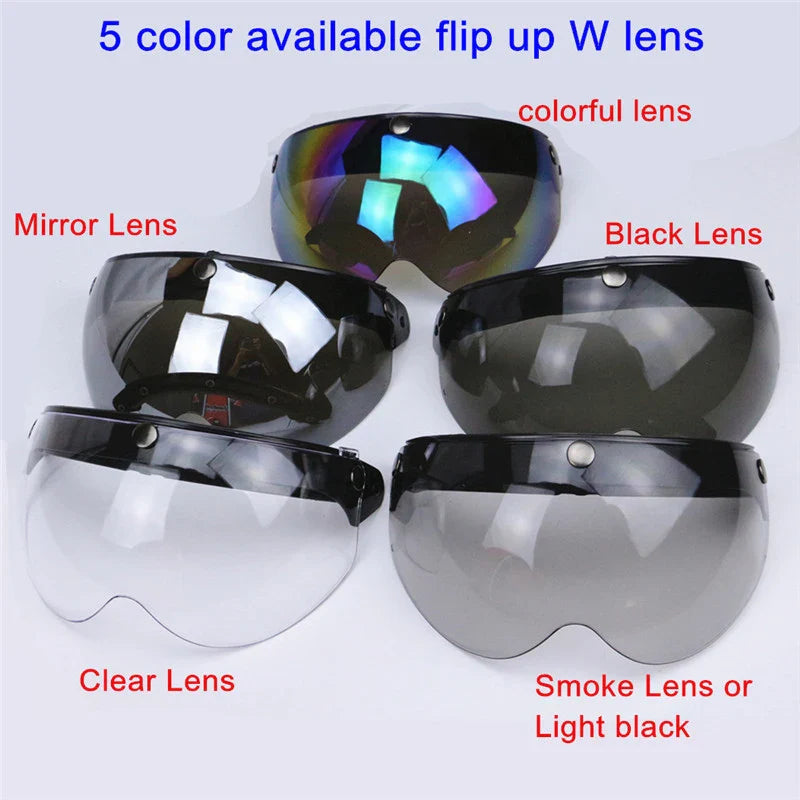 Five different colored lens options for flip-up goggles on a white background.