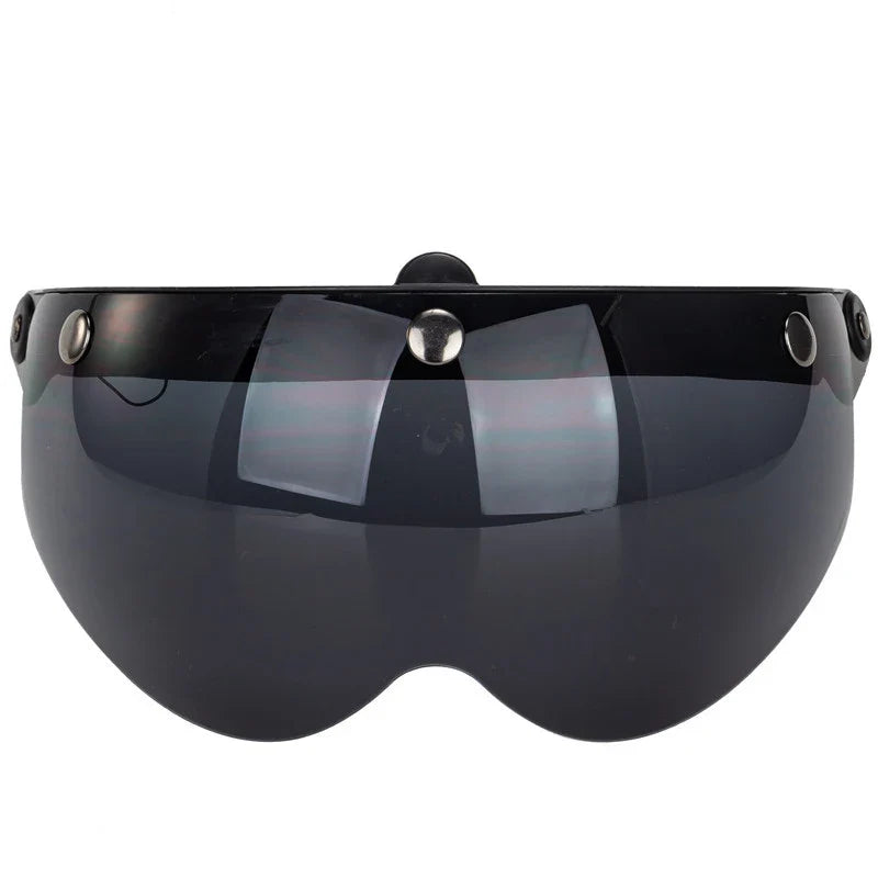 Black helmet visor with silver accents on a white background