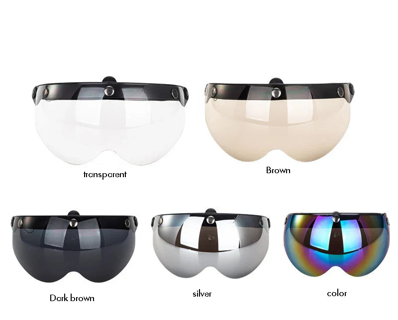 Set of goggles with different colored lenses on a white background
