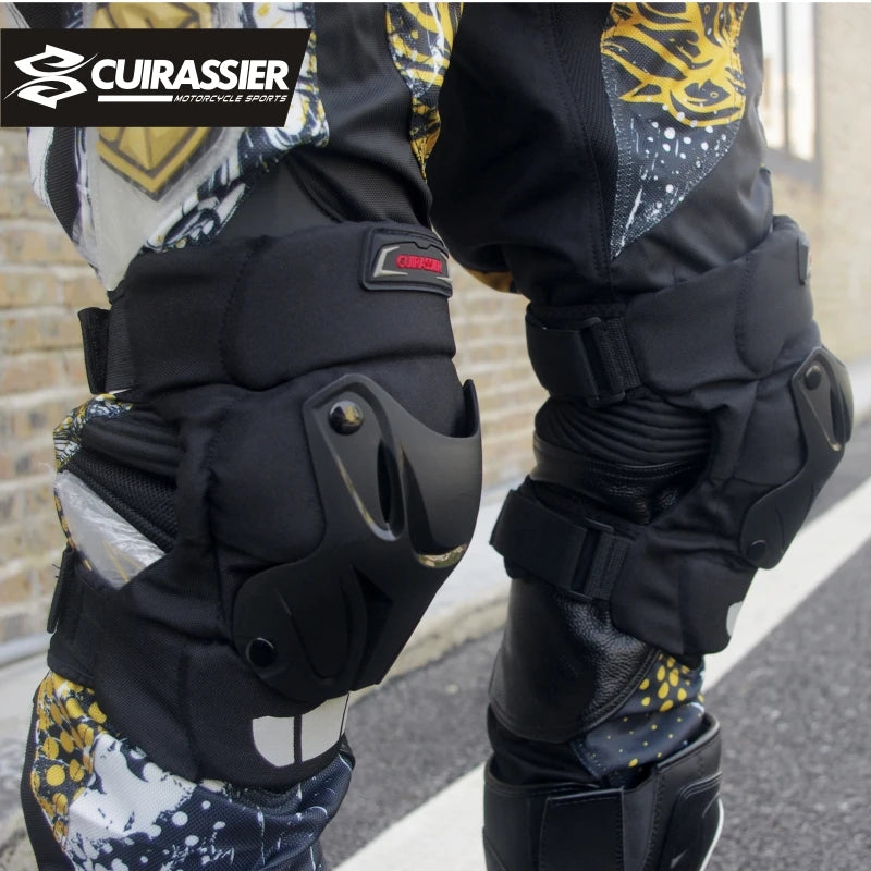 Motorcycle knee and elbow pads with Cuirassier branding on a blurred background
