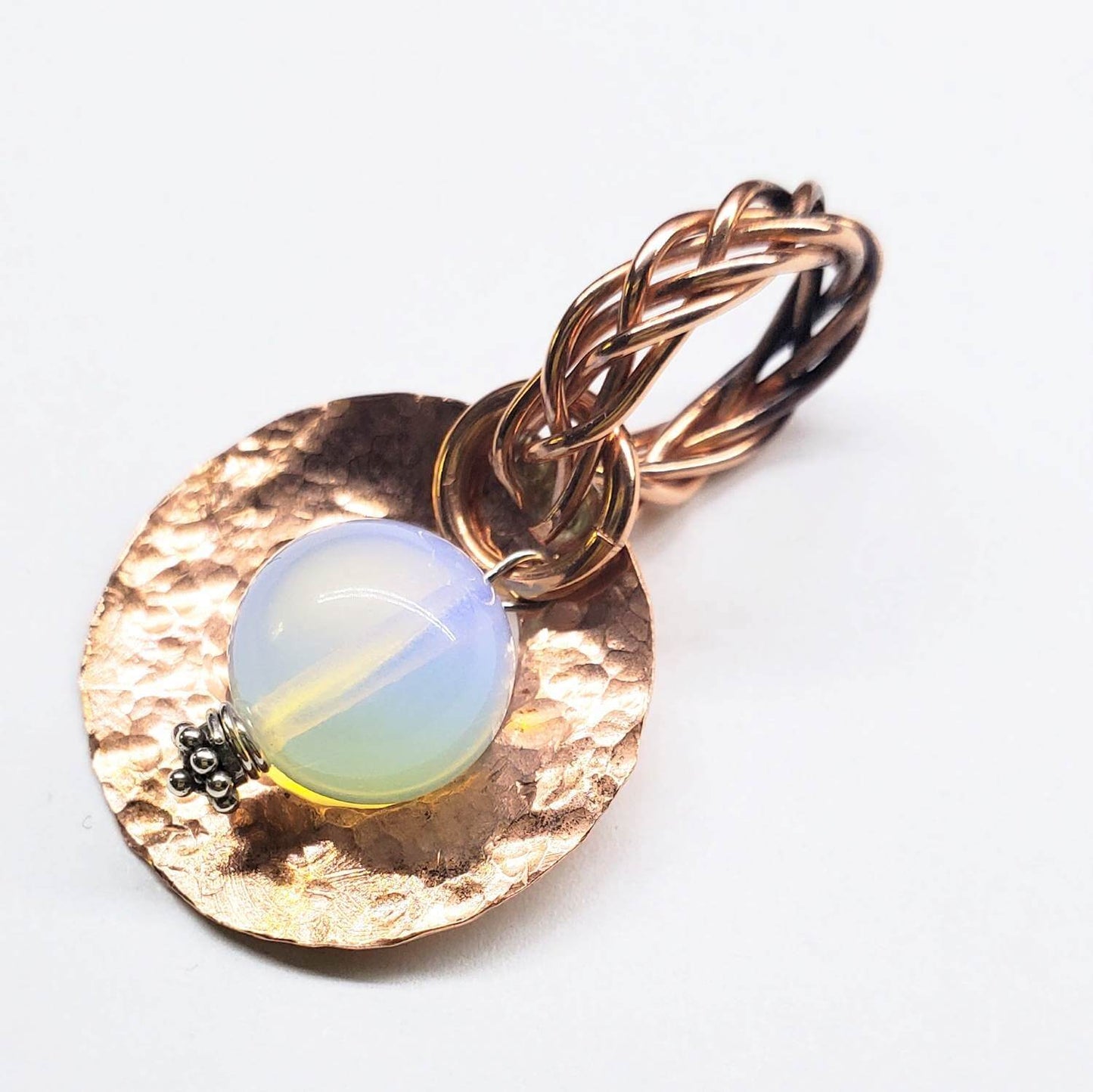 Jewelry pendant with gold chain and opal stone on a white background