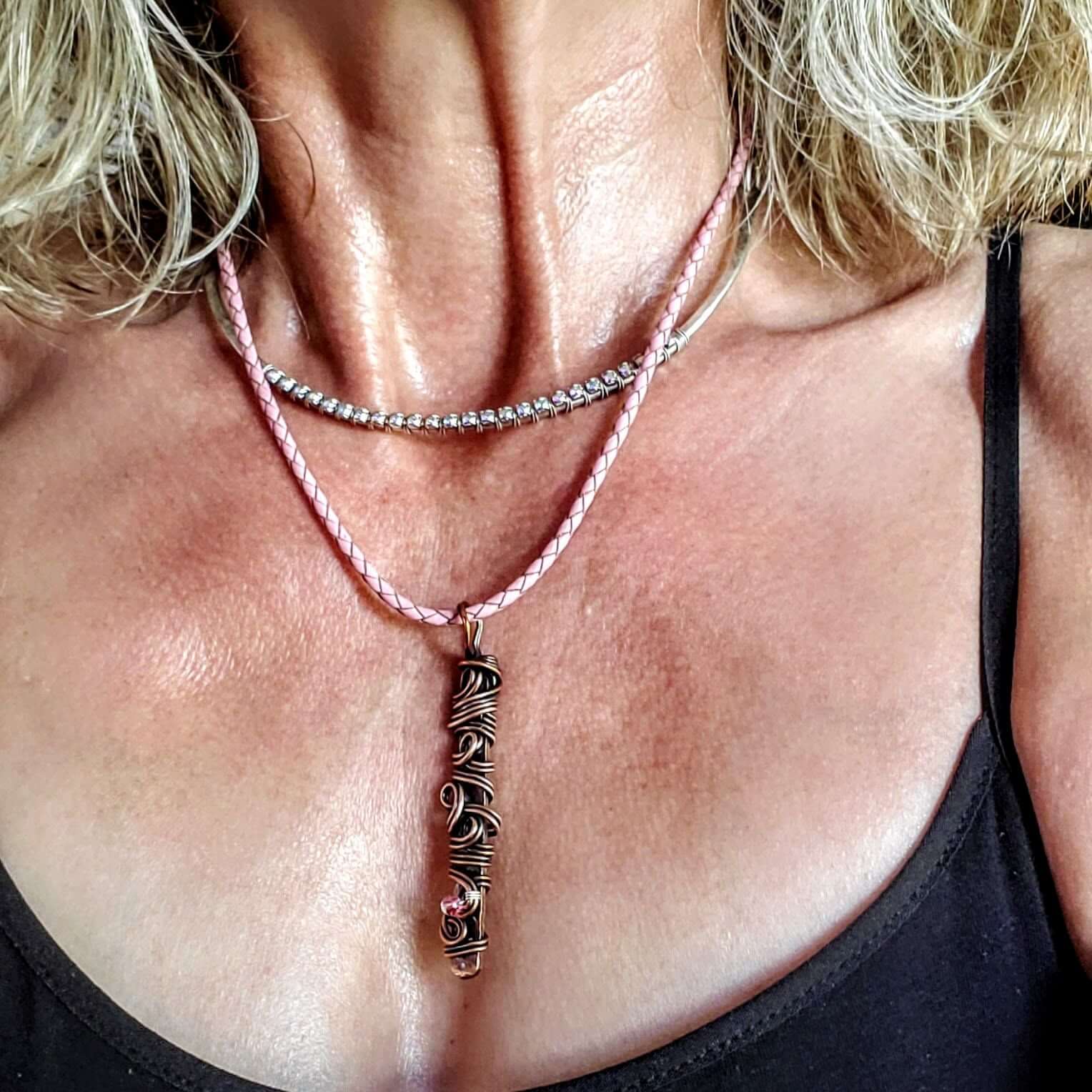 Necklace with a pendant on a person's neck
