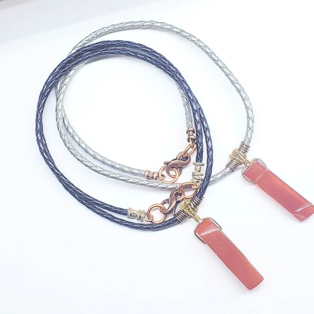 Necklace with pink pendant on a white background