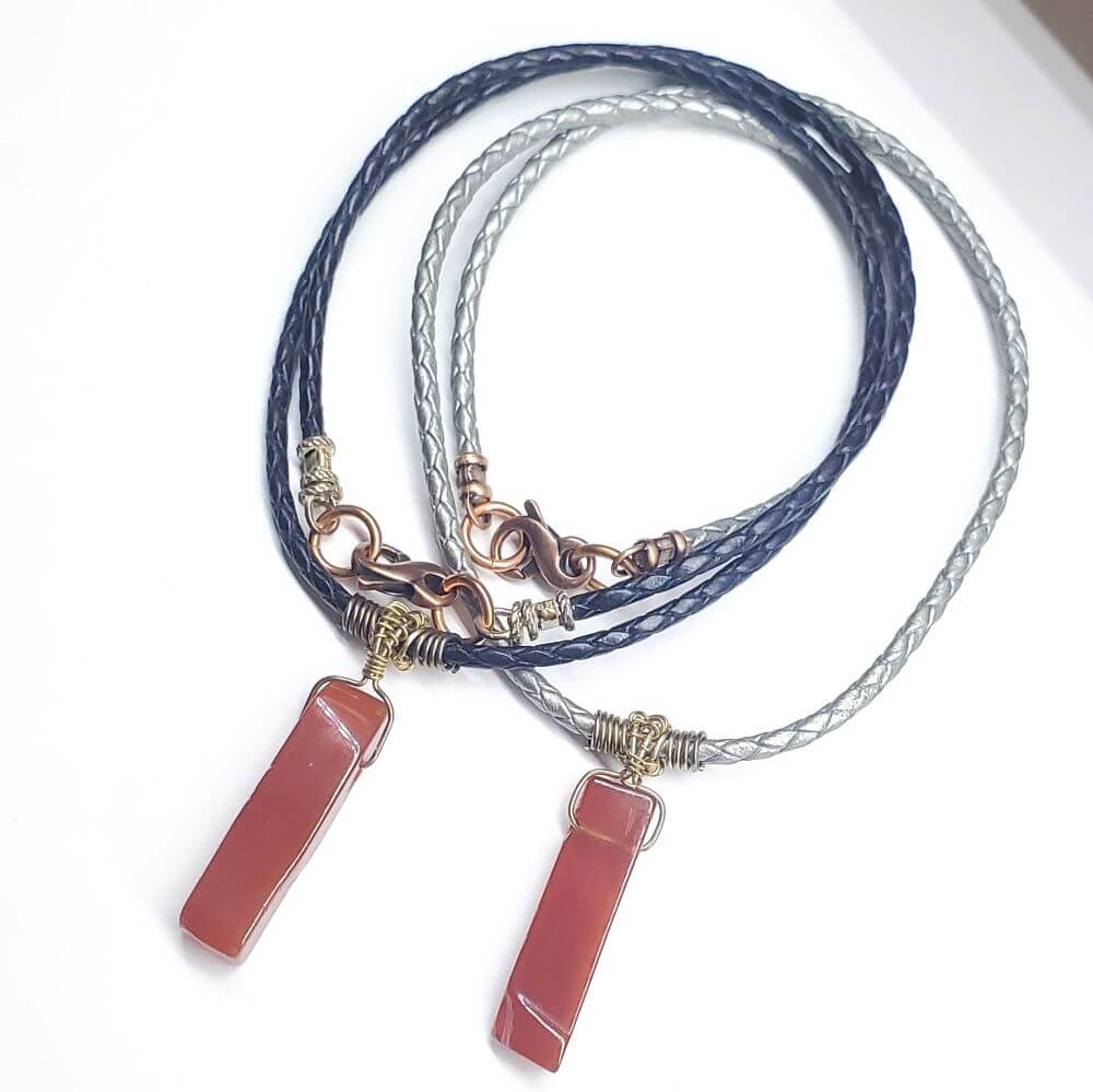 Necklace with pink stone pendants on a white background