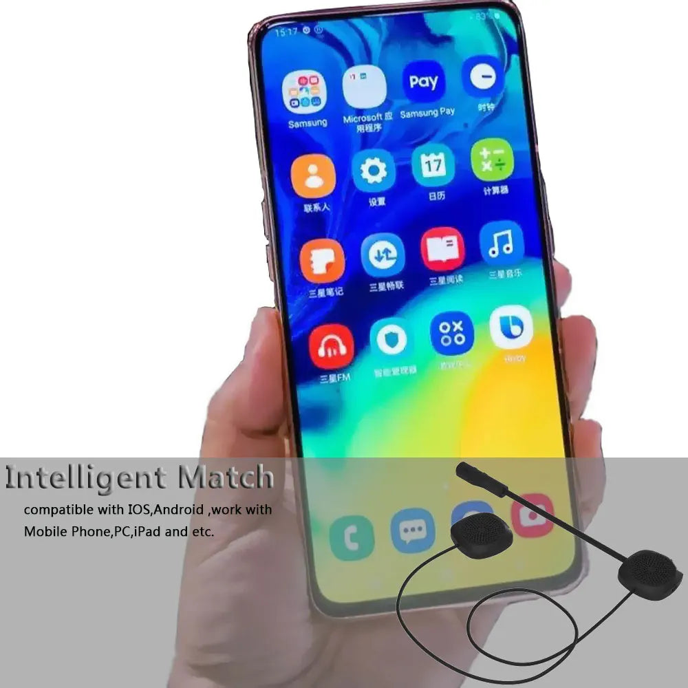 Smartphone held in hand with a headset attached, on a white background