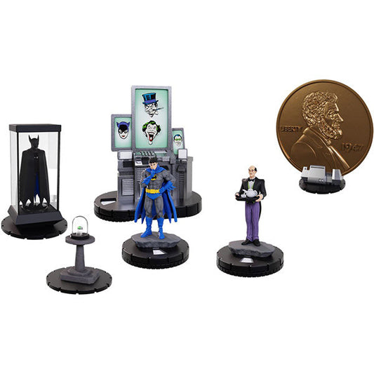 Collection of Batman action figures and memorabilia on a white background