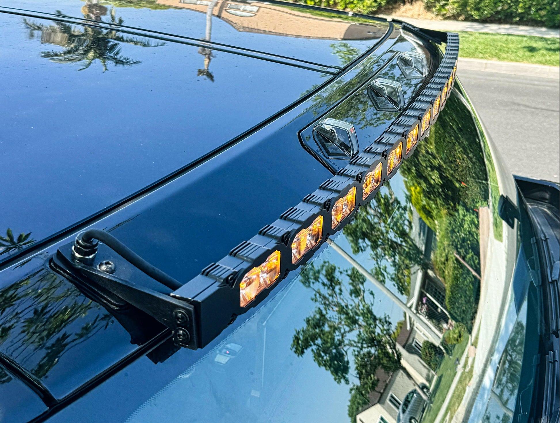 LED light bar on a vehicle's roof with a reflective surface