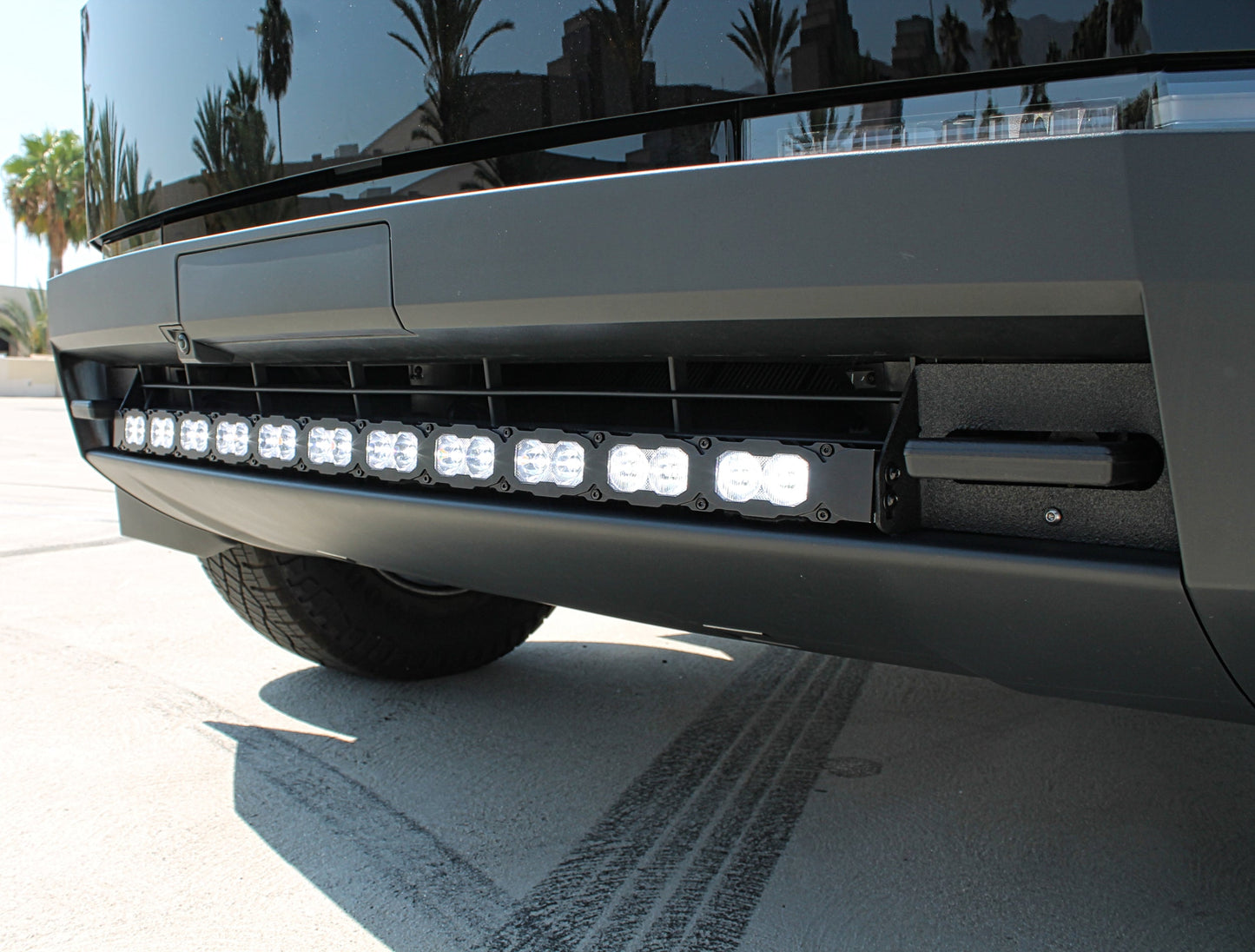 Close-up of a tesla front bumper with LED light bar