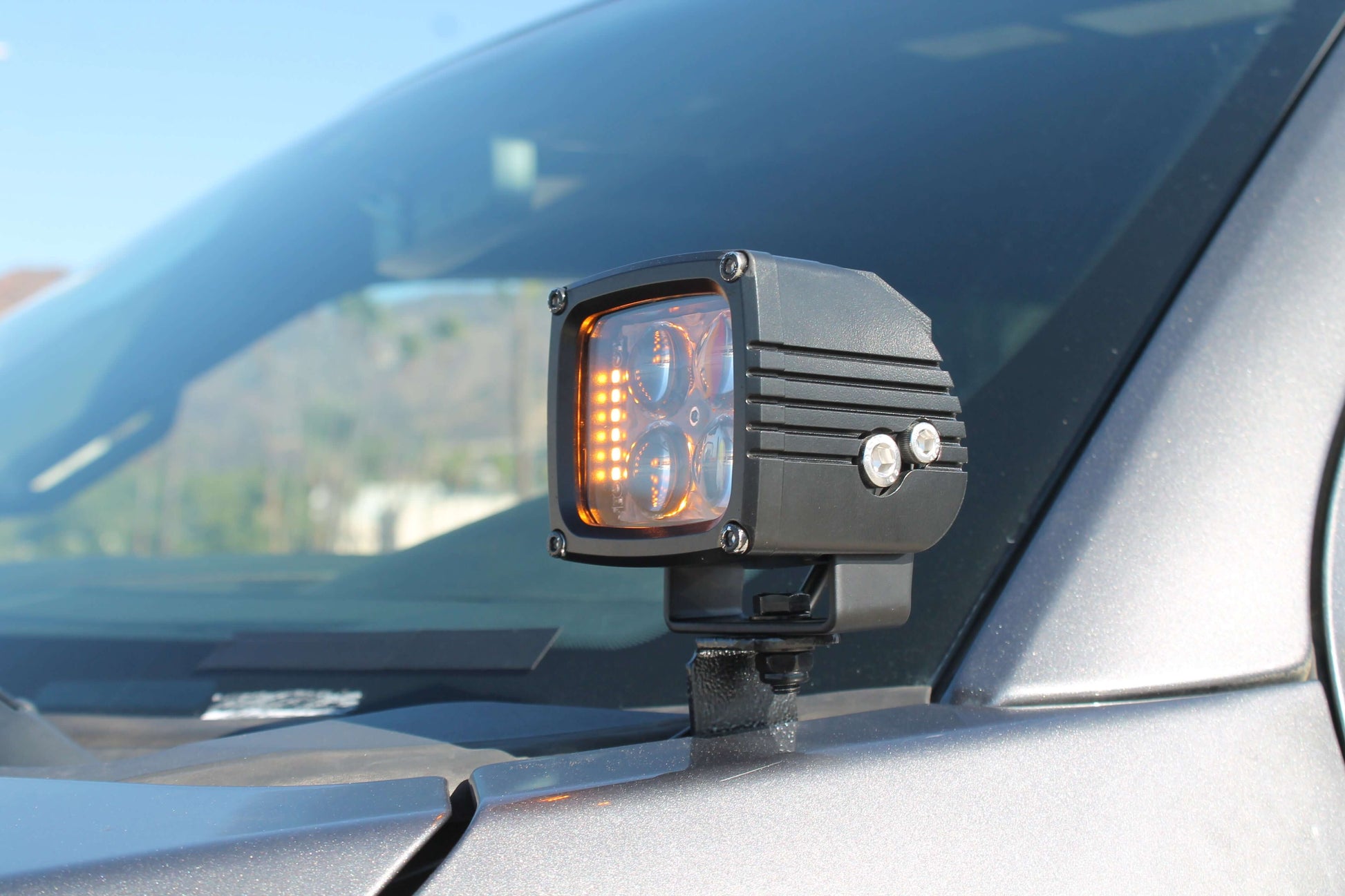 Car side mirror with an additional LED light attached
