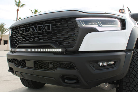 Close-up of a Ram truck grille with LED light bar