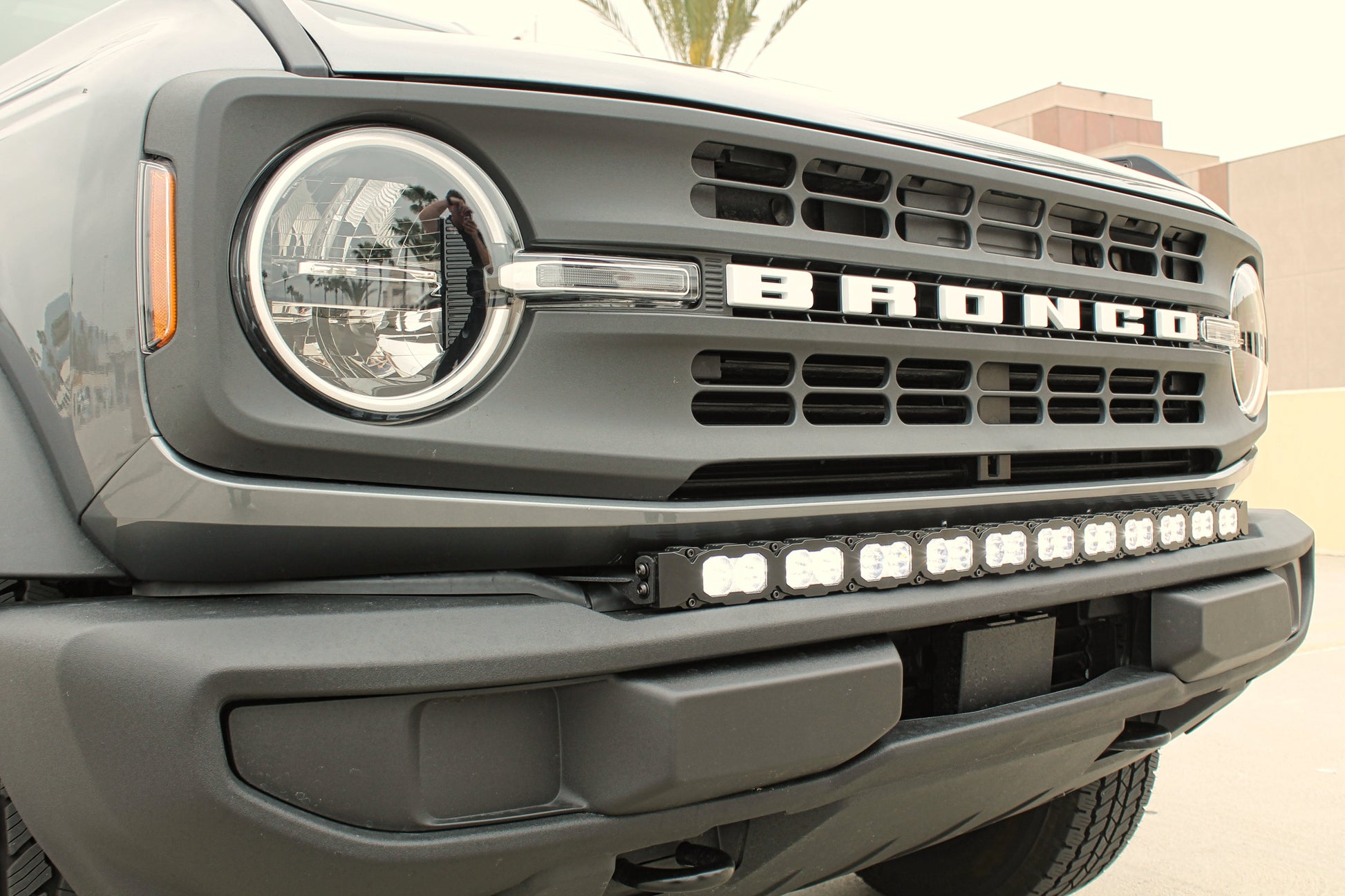 Front view of a Ford Bronco with visible branding and light bar.