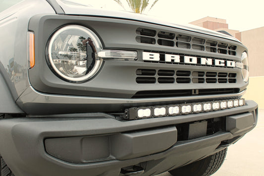 Front view of a Ford Bronco with visible branding and light bar.