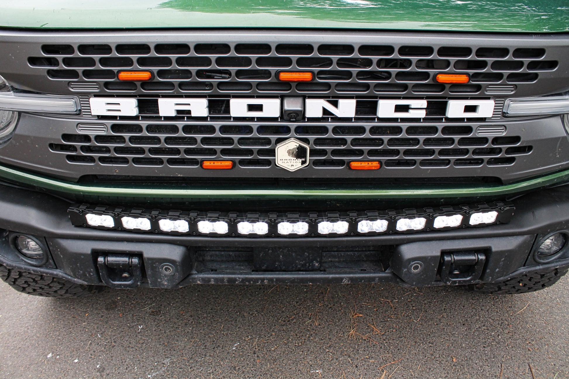 Front grille of a Ford Bronco vehicle with 'Bronco' branding and Light Bar.