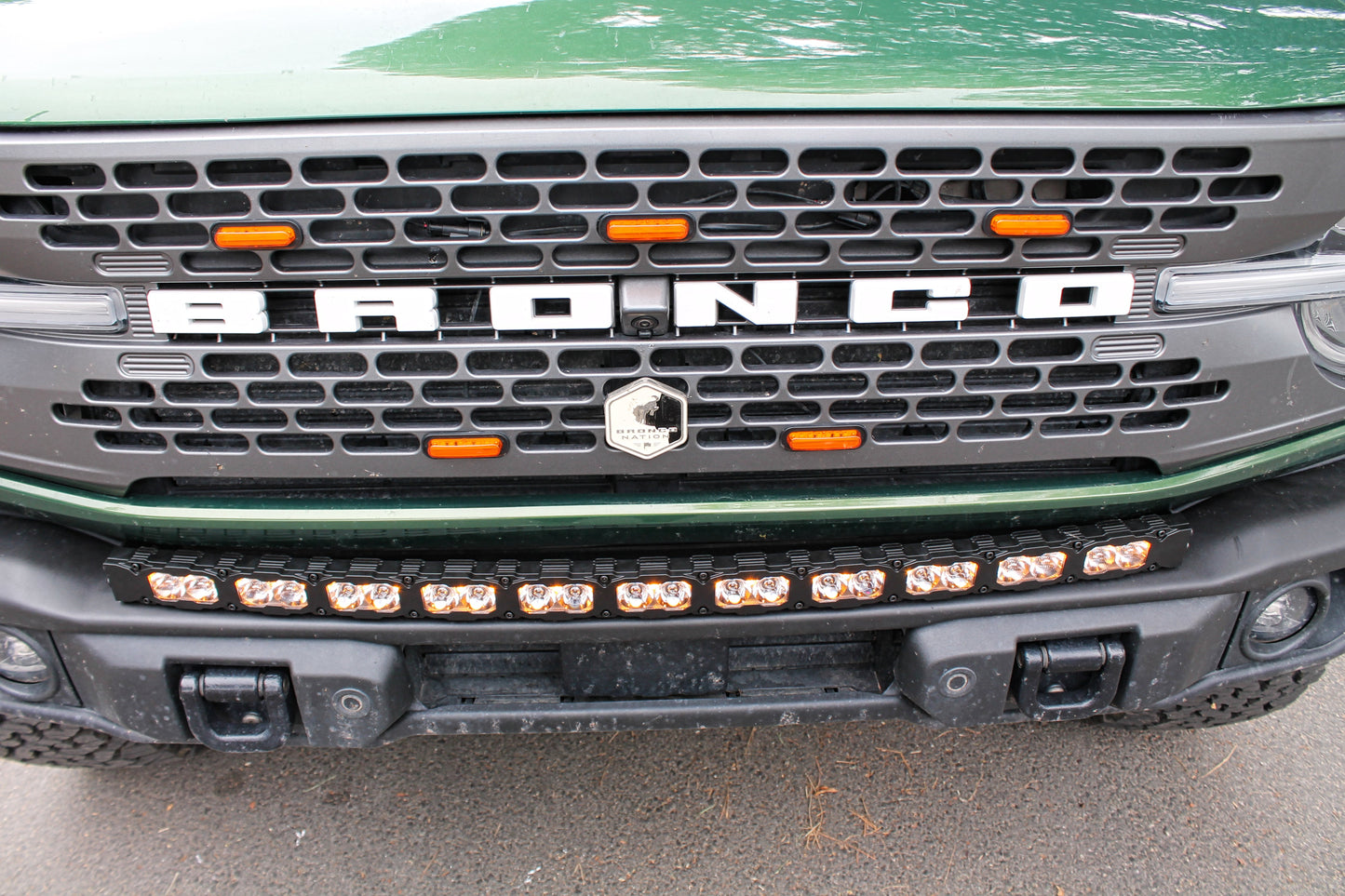 Close-up of a Ford Bronco grille with visible branding and Light Bar.