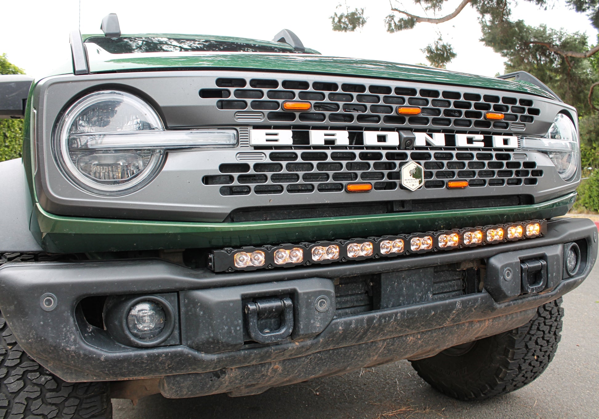Front view of a Ford Bronco with visible branding and mounted light bar.