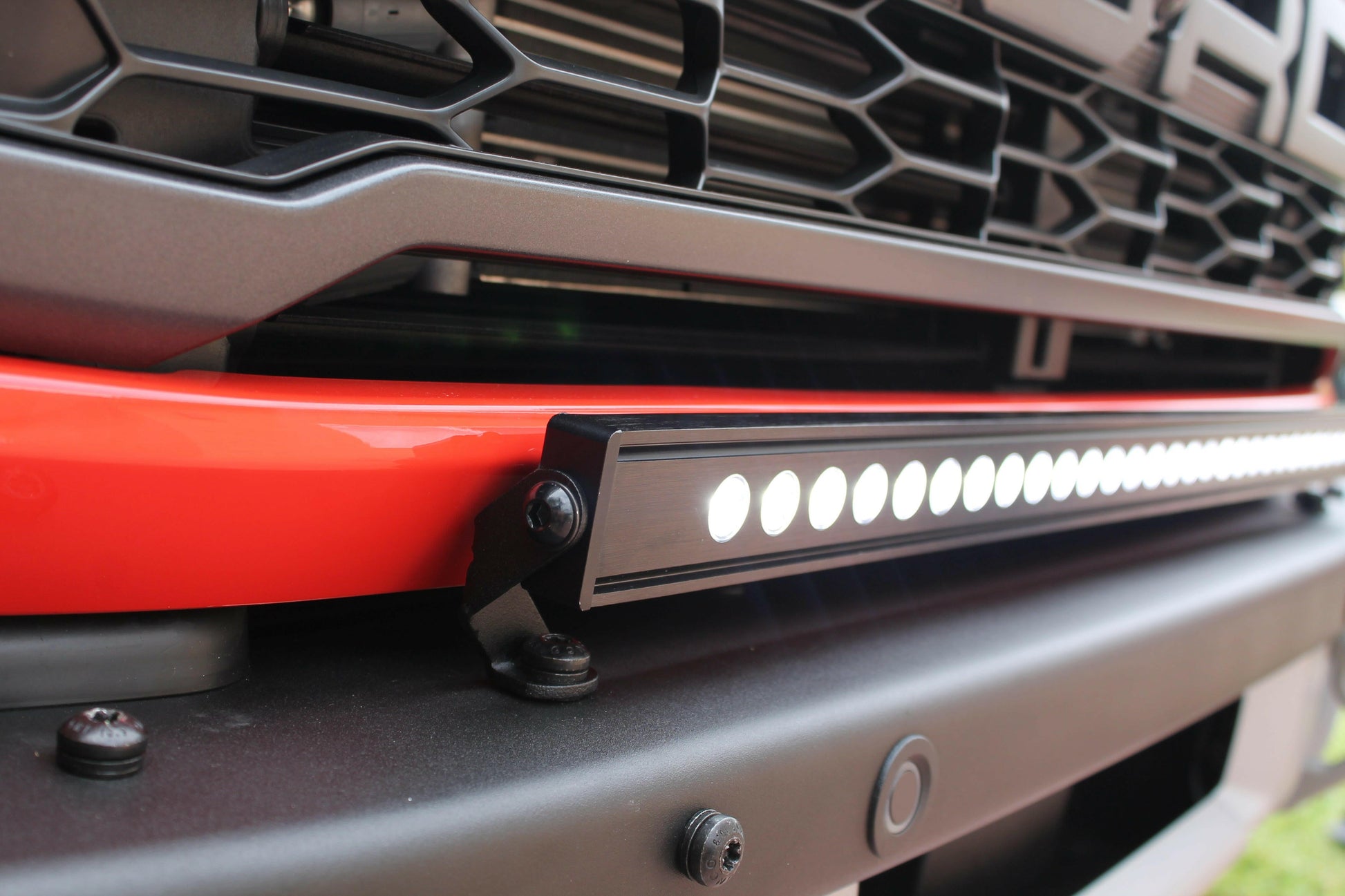 Close-up of a vehicle grille with a LED light bar