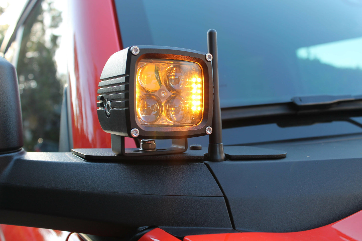 Side view of a vehicle with a fog light on a blurred background