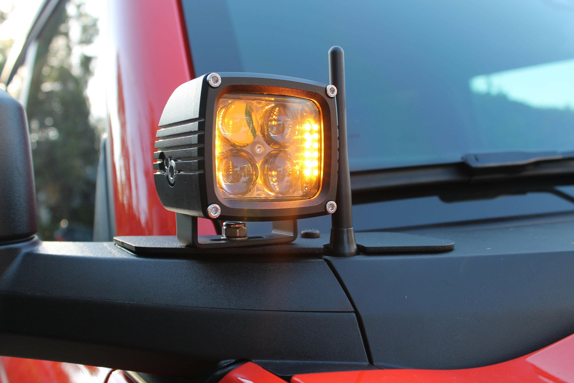 Side view of a vehicle with a fog light on a blurred background